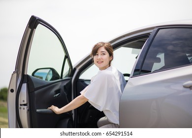 Woman Driver Getting Out Of A Car.