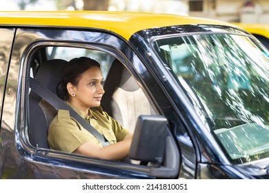 Woman Driver In Uniform Driving A Taxi
