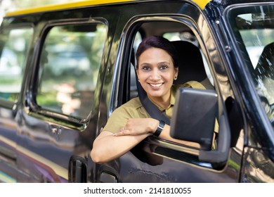 Woman Driver In Uniform Driving A Taxi
