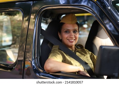 Woman Driver In Uniform Driving A Taxi
