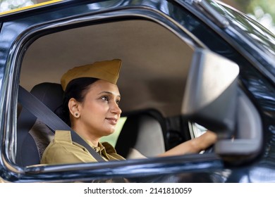 Woman Driver In Uniform Driving A Taxi
