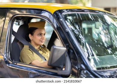 Woman Driver In Uniform Driving A Taxi
