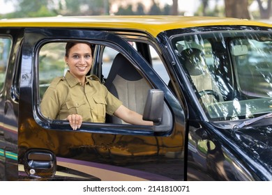 Woman Driver In Uniform Driving A Taxi
