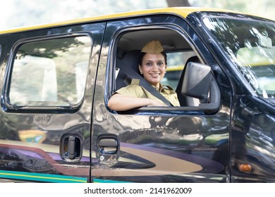 Woman Driver In Uniform Driving A Taxi
