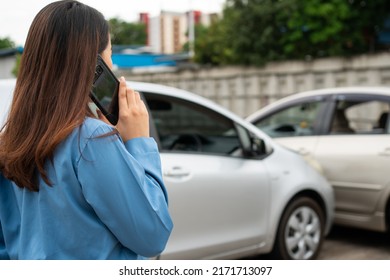 Woman Drivers Call Insurance After A Car Accident Before Taking Pictures And Sending Insurance. Online Car Accident Insurance Claim Idea After Submitting Photos And Evidence To An Insurance Company.