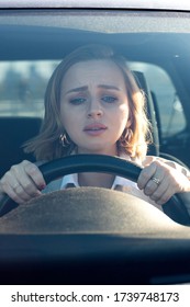 Woman drives her car for the first time, tries to avoid a car accident, is very nervous and scared, worries, clings tightly to the wheel. Inexperienced driver in stress and confusion after an accident - Shutterstock ID 1739748173