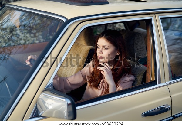 Woman is driving, woman is in the car                   \
           