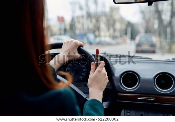        Woman driving a car rear view                  \
                