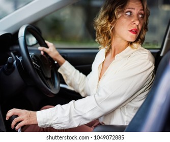 Woman Driving A Car In Reverse