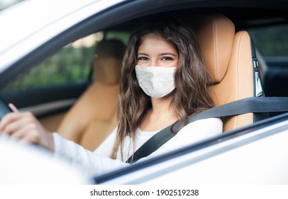 Woman Driving Car While Wearing A Mask, Coronavirus Covid Concept