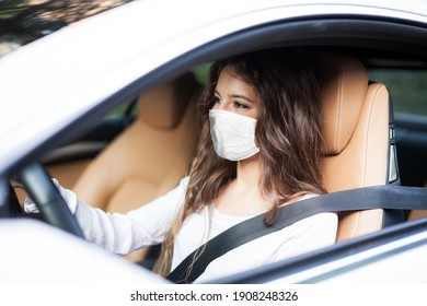 Woman Driving Car While Wearing A Mask, Coronavirus Covid Concept