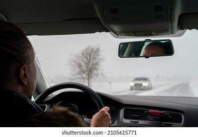 Woman Driving A Car In Winter Time.