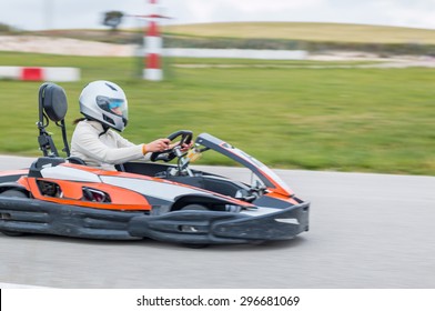 Woman Driving Fast In A Karting Circuit