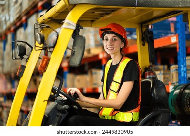 A woman is driving a forklift in a warehouse. She is wearing a safety vest and a hard hat - Powered by Shutterstock