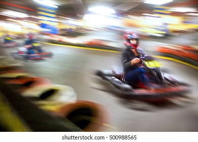 Woman Driving Go Cart On Track