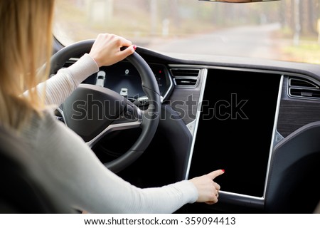 Woman driving new and modern car 