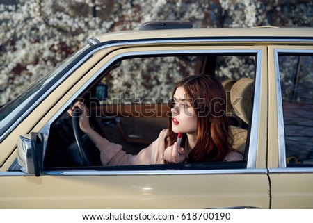      Woman driving a retro car                          