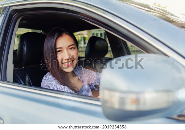 Woman driving with safety : Beautiful\
Asian businesswoman drives to work in a safe and confident vehicle\
as it has insurance coverage : car insurance\
Concept\
