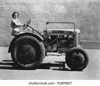 Woman Driving A Tractor