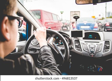 Woman Driving In A Traffic Jam. Rain