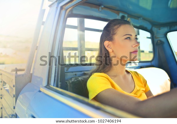 Woman driving a\
truck