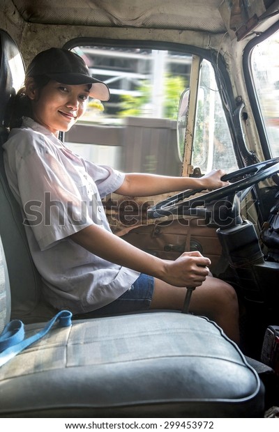 woman driving\
truck