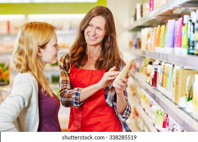 Woman In Drugstore Gets Advice From Saleswoman While Shopping For Cosmetics