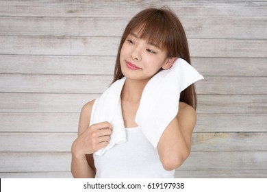 Woman Drying Her Hair With A Towel