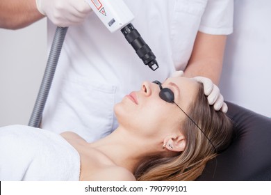 Woman During Face Laser Therapy In Cosmetics 
 Closeup
