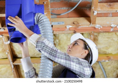 A Woman During Inspection The Ventilation Pipes