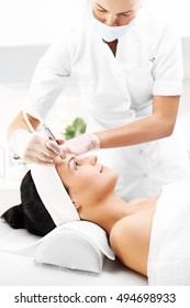 Woman During A Microdermabrasion Treatment In Beauty Salon