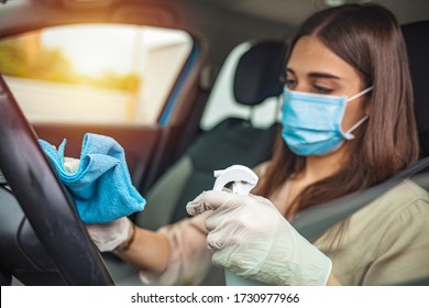 Woman during pandemic isolation at city, she is in car and disinfect. Woman in car disinfecting steering wheel. Adult Woman Disinfecting Car Dash Board with Antiseptic and Wet Wipe - Shutterstock ID 1730977966