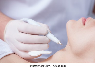 Woman During Wart Removal In Cosmetics Closeup