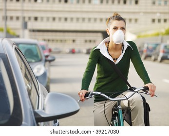 woman with dust mask commuting on bicycle - Powered by Shutterstock