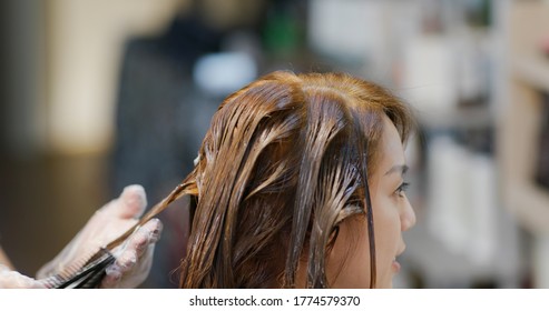 Woman Dye Her Hair In Hair Salon