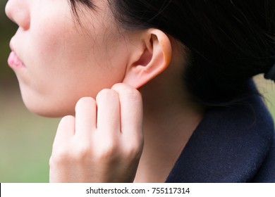 Woman With An Ear Massage