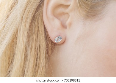 Woman ear wearing beautiful luxury earring - Shutterstock ID 705198811
