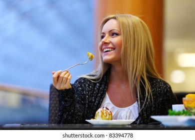 Woman Eat Desert In Caffe