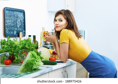 Woman Eat In Kitchen In Cooking Time. Bio Fruit, Vegetarian Diet.