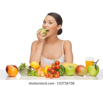 Woman Eating Apple With Lot Of Fruits And Vegetables