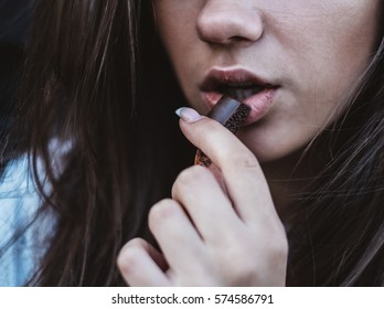woman eating chocolate - Shutterstock ID 574586791