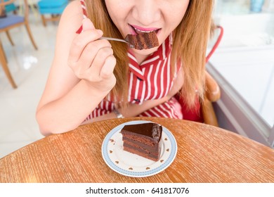 Woman Eating Chocolate Cake