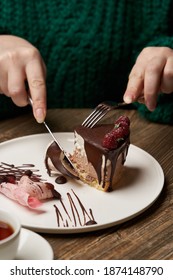 Woman Eating Chocolate Cake With Raspberry. Woman Hands Cutting Chocolate Mousse Cake With Raspberry