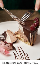 Woman Eating Chocolate Cake With Raspberry. Woman Hands Cutting Chocolate Mousse Cake With Raspberry