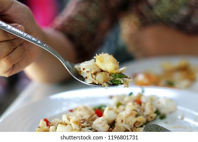 Woman Eating Crab Meat Thai Food In A Spoon. Close Up Background Texture 