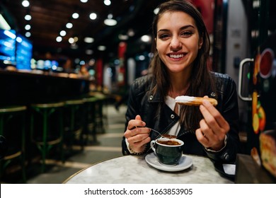 Woman Eating Deseert With Chocolate.Craving For Sweet And Carbs.Breaking The Diet.Happy Tourist Enoying Traditional Fried Dough Pastry Desert Churros With Sugar Dipped In Hot Chocolate Saucein Spain.