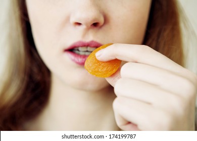 Woman Eating Dried Fruit