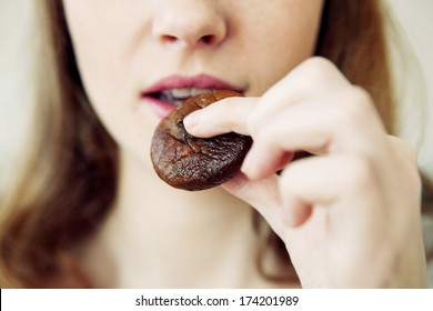 Woman Eating Dried Fruit