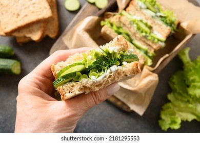 Woman Eating English Tea Sandwich With Cucumber, Cream Cheese, Dill. Close Up. Freshness Traditional Cold British Summer Appetizer.