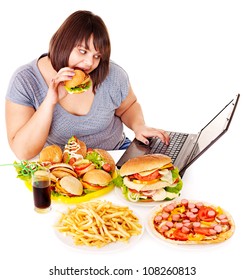 Woman Eating Fast Food At Working Pc. Isolated.